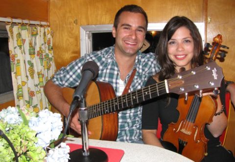 Erin Slaver and Justin Sutherland around the kitchen tab in the Beeline Trailer.